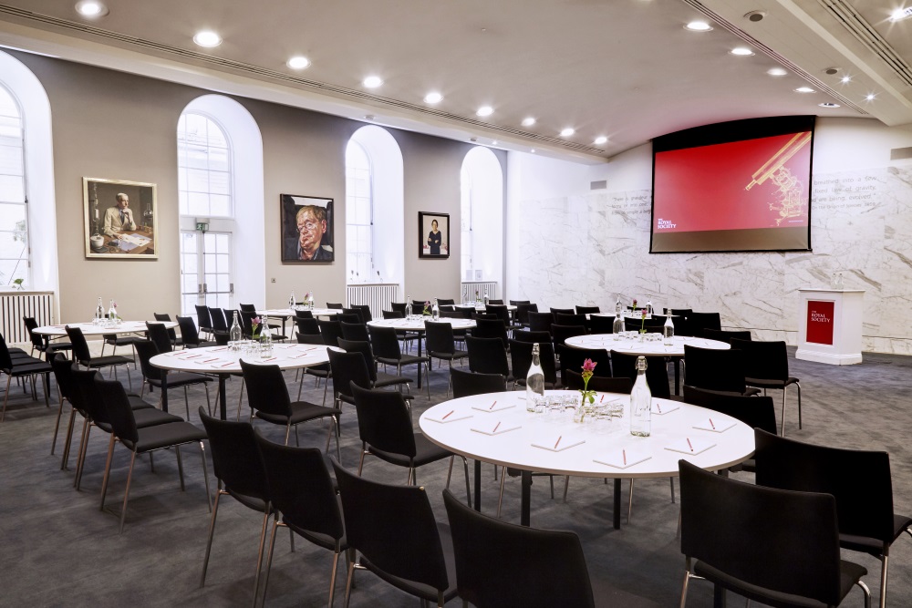 White tables organised in a cabaret layout.