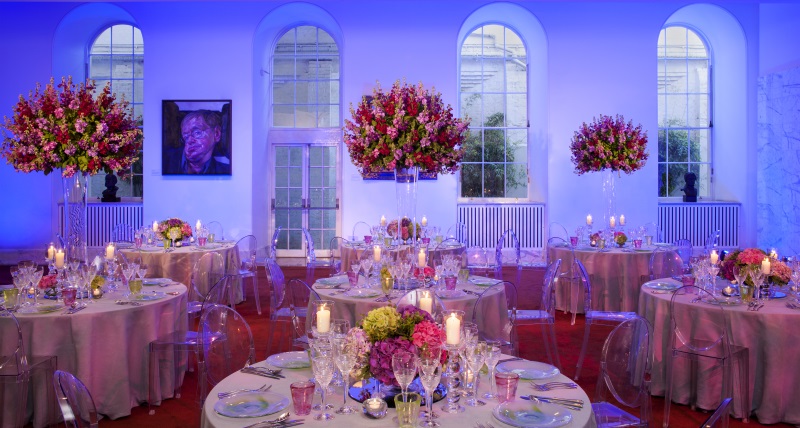 Round white tables tastefully organised for dining.