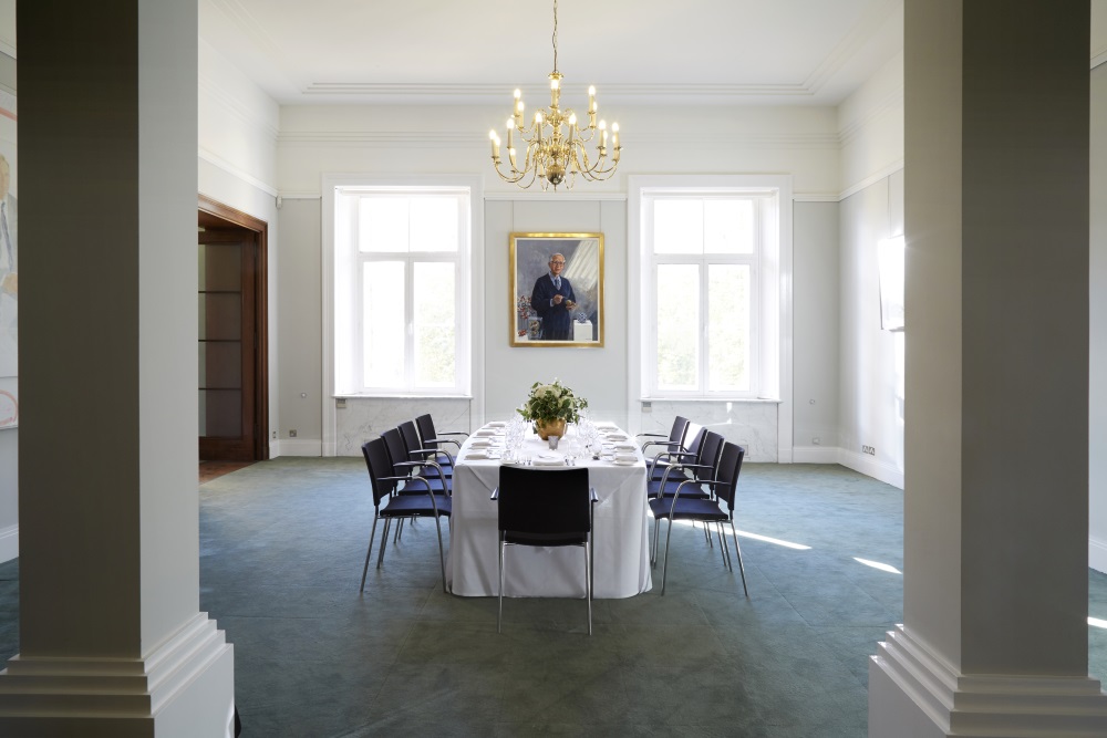 A large white table set for dining.