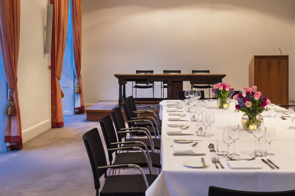 A large white table set for dining.