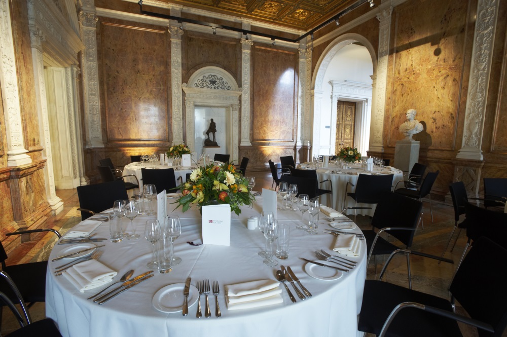 White tables set for dinner.