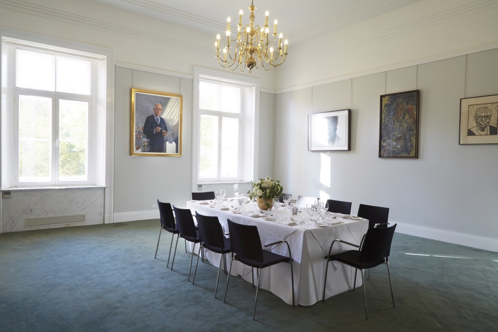 A large white table set for dining.