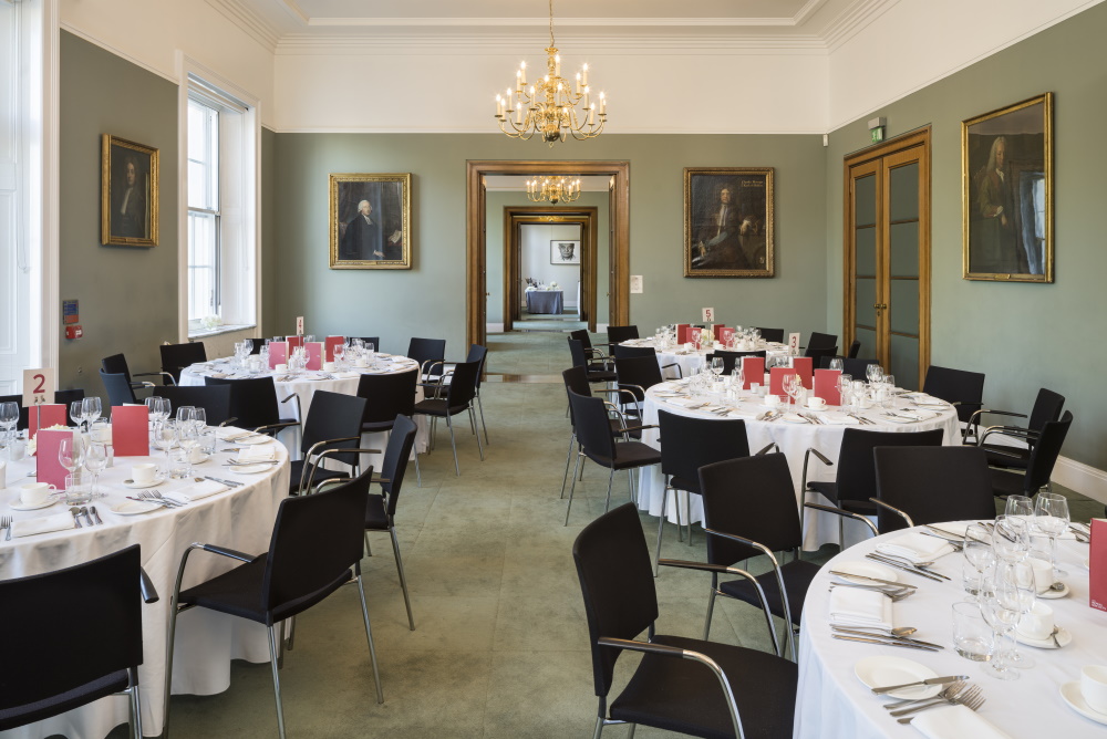 Round white tables set for dinner.