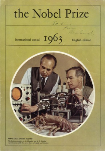 The cover of the 1963 Nobel Prize booklet. The cover features a circular photograph of the British scientists Andrew Huxley and Alan Hodgkin posing with equipment and lobster model. The booklet cover is a shade of yellow.