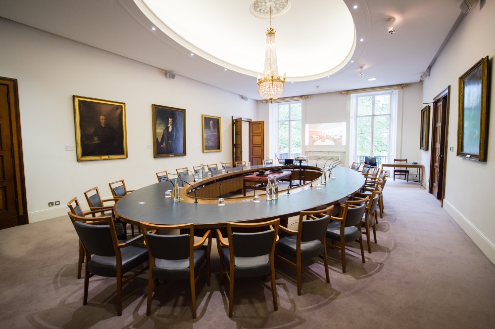 A large hollow oval table.