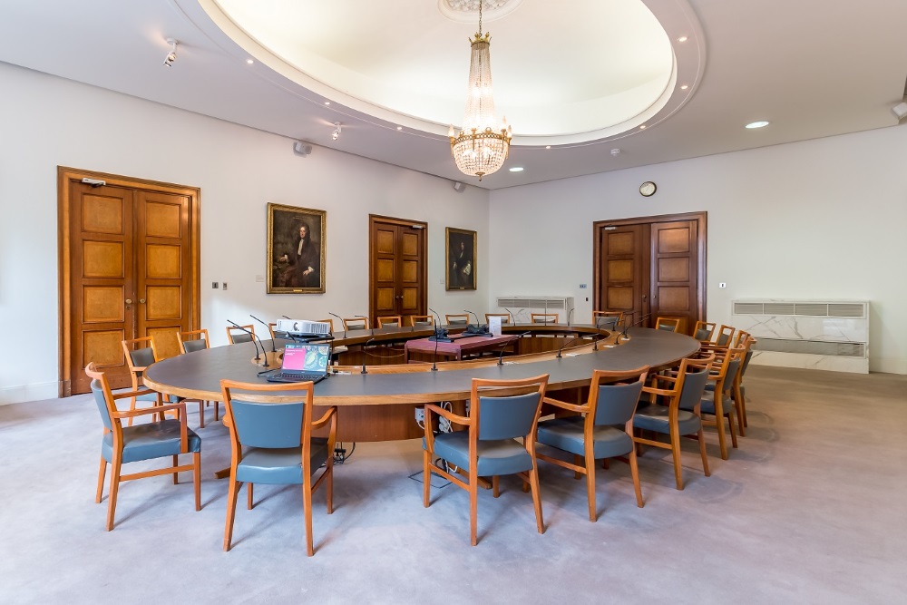 A large hollow oval table.