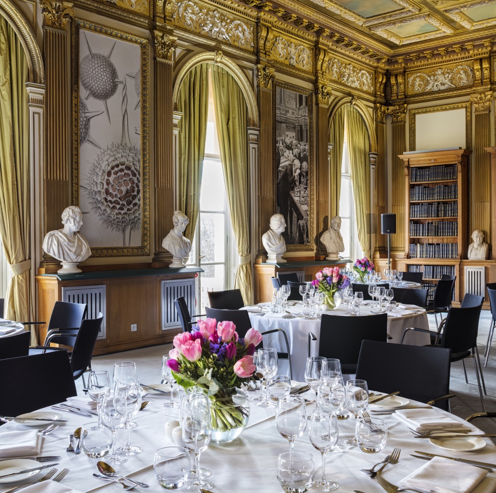 Tables adorned with dinner sets.