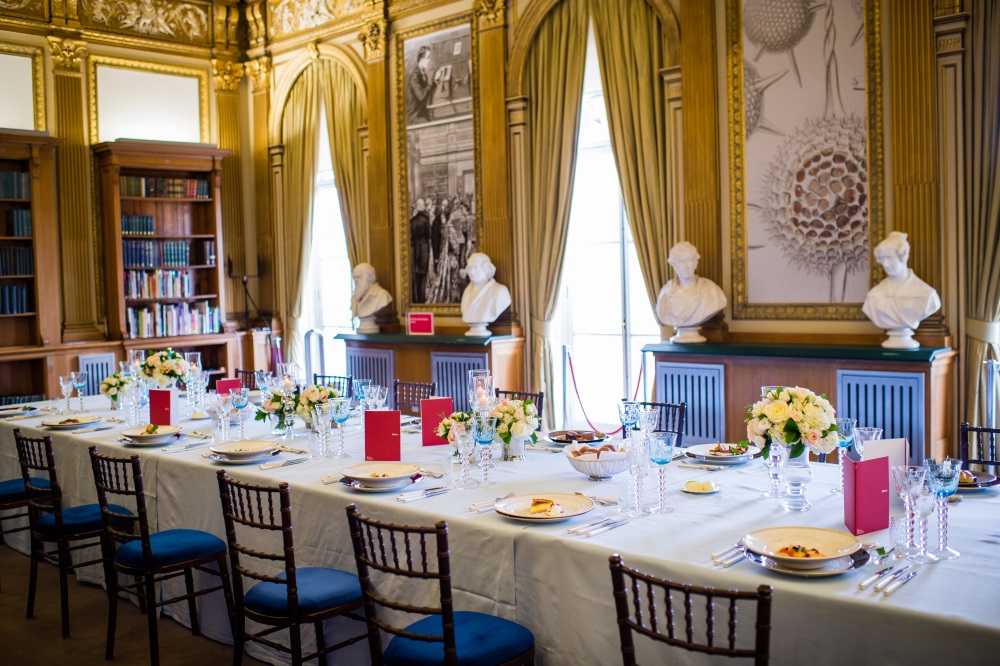 A large white table set for dinner.