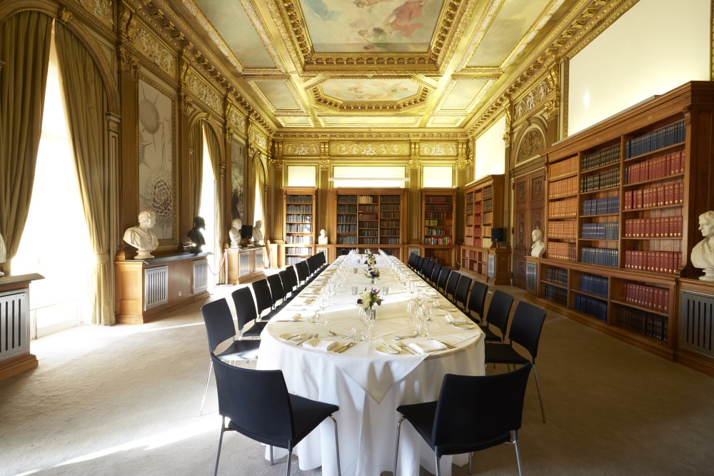 A large white table set for dinner.