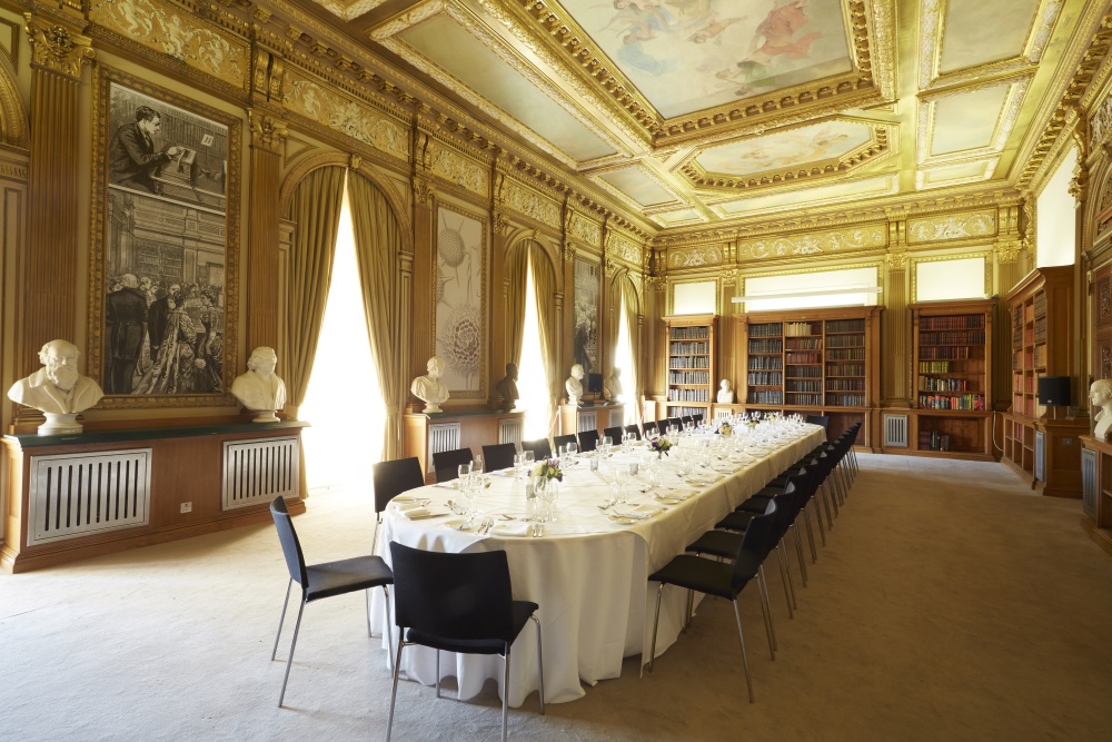 A large white table set for dinner.