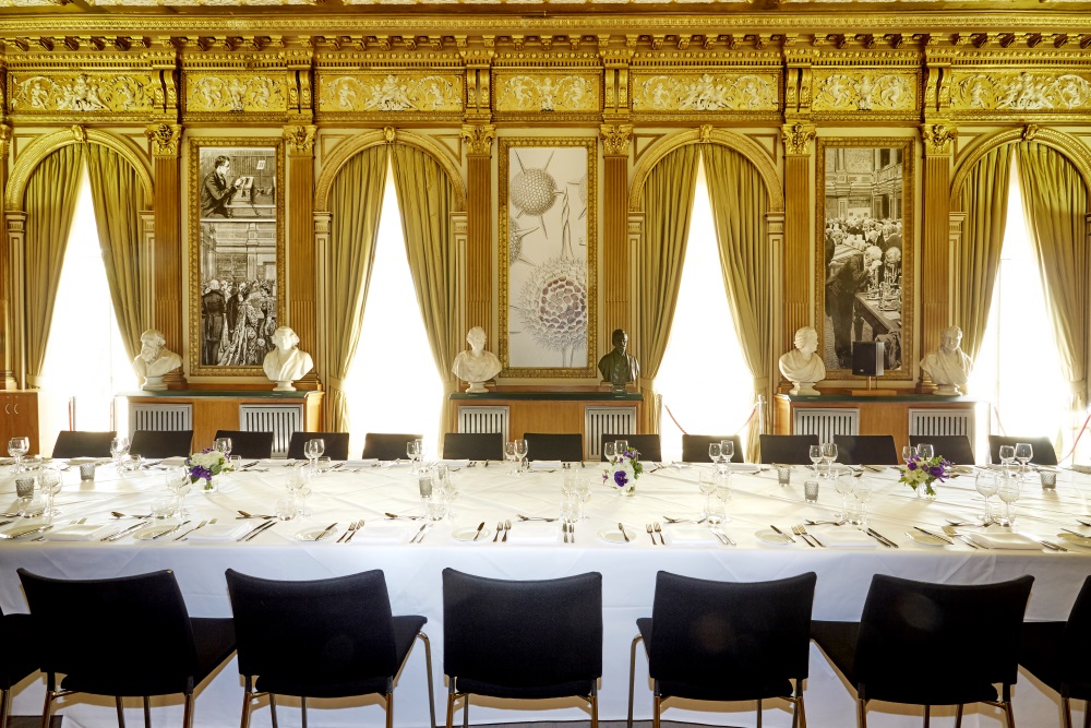 A large white table set for dinner.